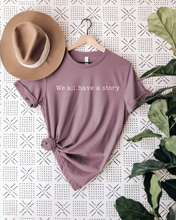 Load image into Gallery viewer, We All Have a Story' Unisex T-Shirt – Embrace Your Narrative