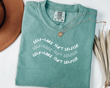 Load image into Gallery viewer, "Self-Care Isn't Selfish" unisex Comfort Colors t-shirt by Say Hello Threads, emphasizing the importance of self-care.