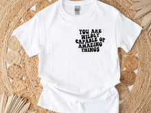 Load image into Gallery viewer, "Wildly Capable" unisex t-shirt by Say Hello Threads, inspiring confidence and empowerment.
