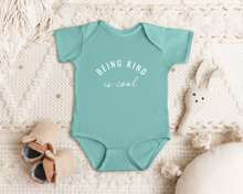 Load image into Gallery viewer, &quot;Being Kind is Cool&quot; infant onesie by Say Hello Threads, promoting kindness as a core value.
