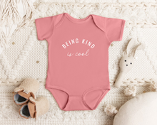 Load image into Gallery viewer, &quot;Being Kind is Cool&quot; infant onesie by Say Hello Threads, promoting kindness as a core value.
