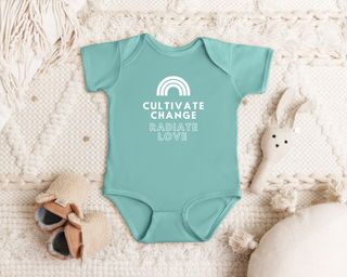 "Cultivate Change" infant onesie by Say Hello Threads, featuring a rainbow design promoting growth and positivity.