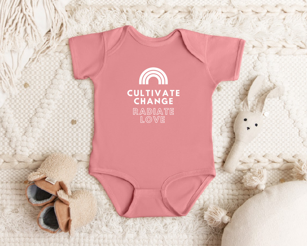 "Cultivate Change" infant onesie by Say Hello Threads, featuring a rainbow design promoting growth and positivity.