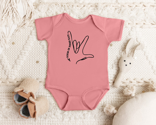 "Love Needs No Words" infant onesie by Say Hello Threads, highlighting love through American Sign Language.