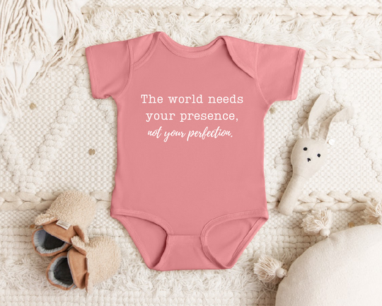 The world needs your presence not your perfection infant onesie by Say Hello Threads, emphasizing mindfulness and authenticity.