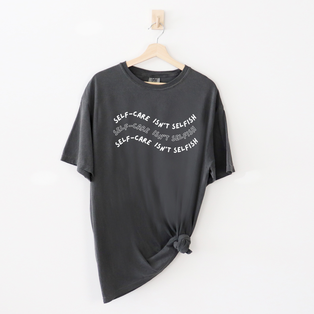 "Self-Care Isn't Selfish" unisex Comfort Colors t-shirt by Say Hello Threads, emphasizing the importance of self-care.