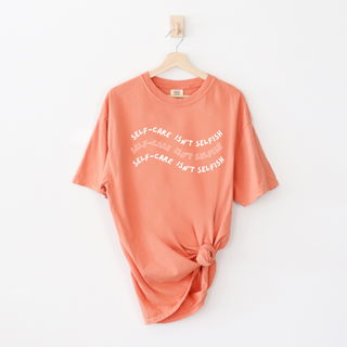 "Self-Care Isn't Selfish" unisex Comfort Colors t-shirt by Say Hello Threads, emphasizing the importance of self-care.